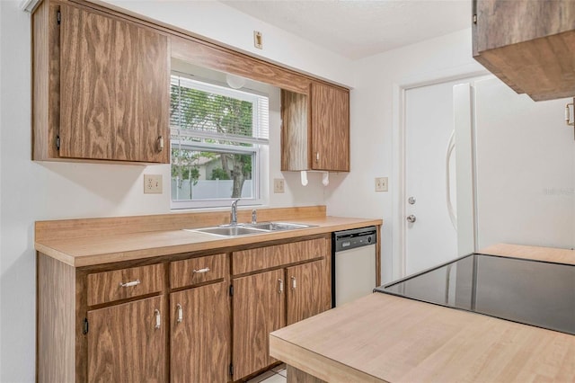 231 S Barbour St, Beverly Hills, FL 34465 - kitchen featuring dishwashing machine, freestanding refrigerator, light countertops, brown cabinetry, and electric range oven