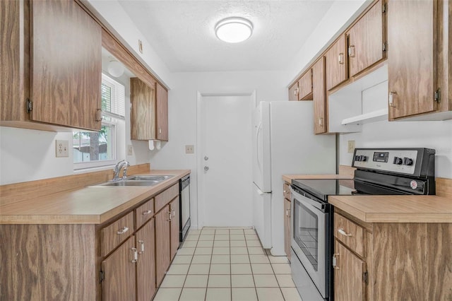 231 S Barbour St, Beverly Hills, FL 34465 - kitchen featuring electric range, dishwashing machine, light countertops, and a textured ceiling