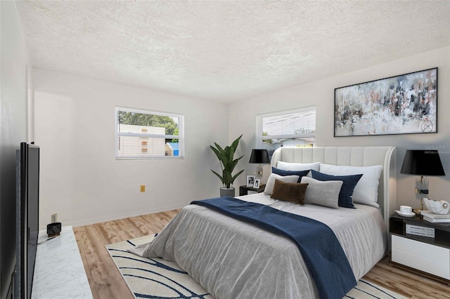 231 S Barbour St, Beverly Hills, FL 34465 - bedroom with multiple windows, a textured ceiling, and light wood finished floors
