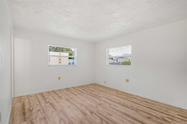 231 S Barbour St, Beverly Hills, FL 34465 - unfurnished room featuring light wood-style floors and a textured ceiling