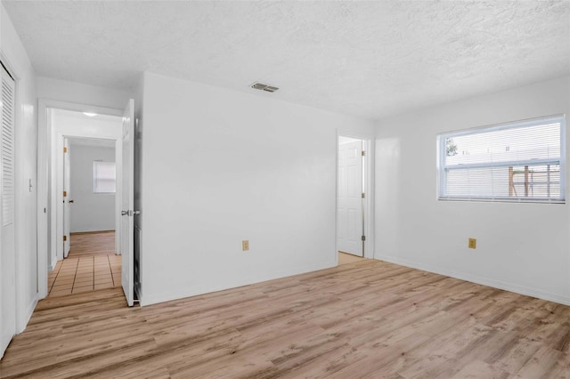 231 S Barbour St, Beverly Hills, FL 34465 - empty room with light wood-style flooring and a textured ceiling