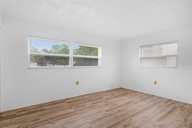 231 S Barbour St, Beverly Hills, FL 34465 - empty room with wood finished floors and a textured ceiling