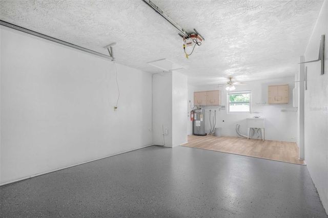 231 S Barbour St, Beverly Hills, FL 34465 - garage featuring water heater and ceiling fan