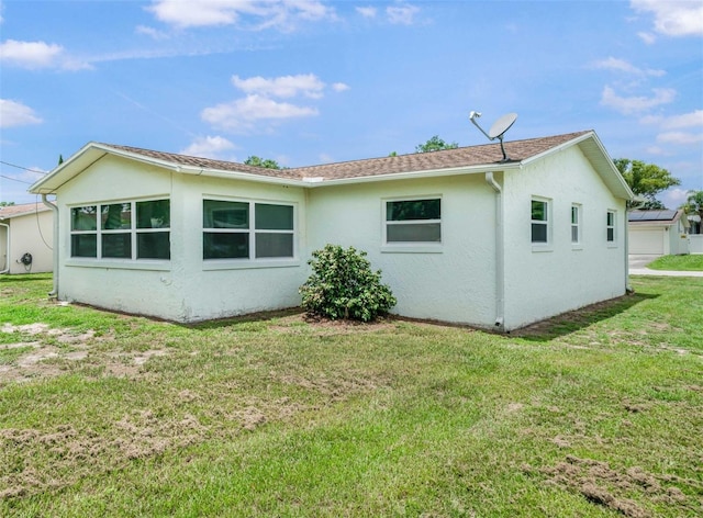 231 S Barbour St, Beverly Hills, FL 34465 - rear view of property featuring stucco siding and a yard
