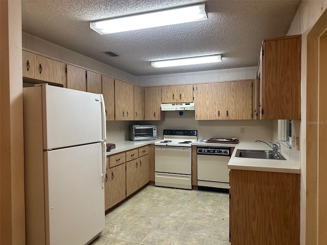 8470 SW 92nd Ln Unit F, Ocala, FL 34481 - kitchen with white appliances, under cabinet range hood, a textured ceiling, and light countertops