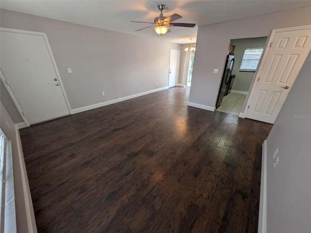 2564 SE 15th Ave Unit G, Ocala, FL 34471 - unfurnished living room featuring ceiling fan, a chandelier, and dark wood-style floors