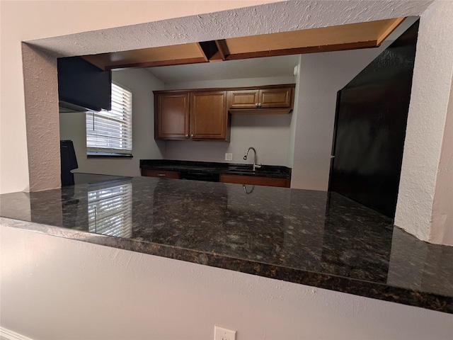 2564 SE 15th Ave Unit G, Ocala, FL 34471 - kitchen with a peninsula and dark stone countertops