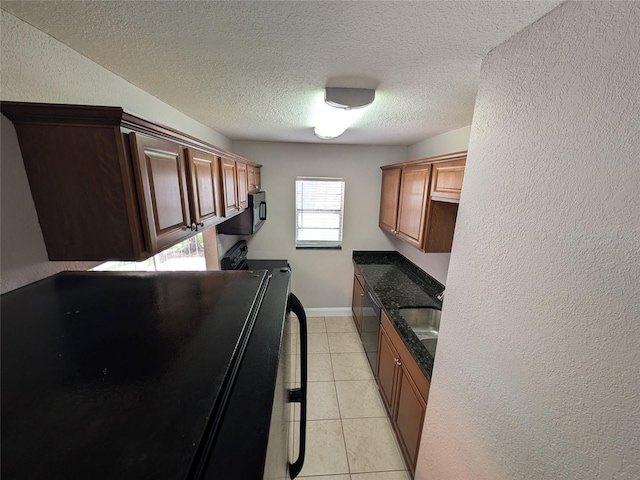 2564 SE 15th Ave Unit G, Ocala, FL 34471 - laundry room with cabinet space, a textured ceiling, a textured wall, light tile patterned floors, and independent washer and dryer