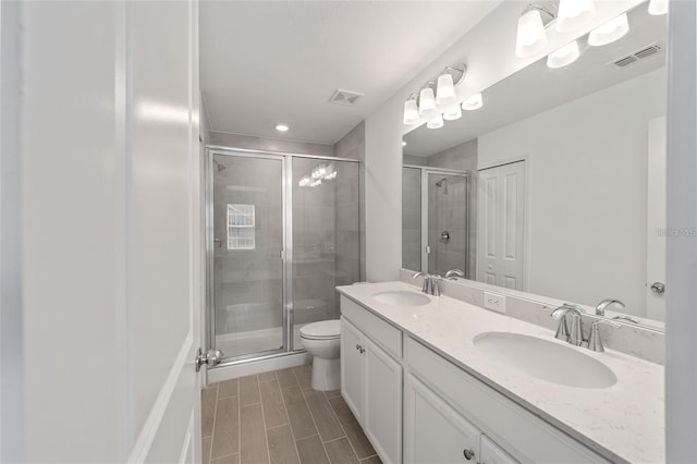 3409 SW 34th Ave Circle Unit 5, Ocala, FL 34474 - full bath featuring double vanity, a shower stall, wood finish floors, and recessed lighting