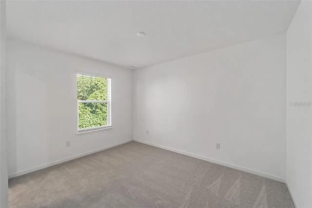 3409 SW 34th Ave Circle Unit 5, Ocala, FL 34474 - carpeted empty room featuring baseboards
