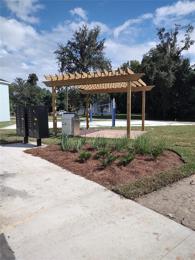 3409 SW 34th Ave Circle Unit 5, Ocala, FL 34474 - view of community featuring mail area and a pergola