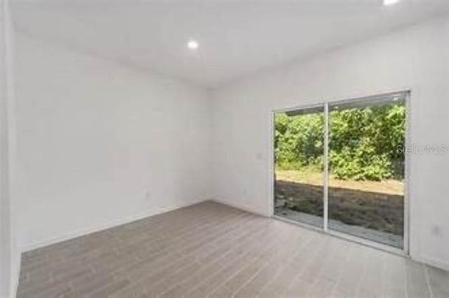 3409 SW 34th Ave Circle Unit 5, Ocala, FL 34474 - empty room featuring recessed lighting and wood finished floors