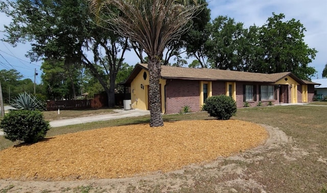 406WRIGHTST Wright St, Inverness, FL 34452 - single story home with concrete driveway, a garage, brick siding, and a front yard