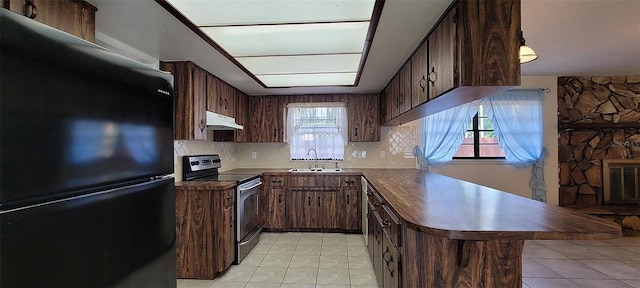 406WRIGHTST Wright St, Inverness, FL 34452 - kitchen featuring freestanding refrigerator, dark countertops, stainless steel electric stove, light tile patterned flooring, and backsplash