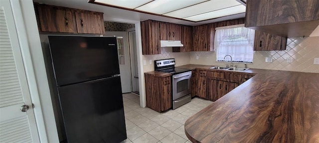 406WRIGHTST Wright St, Inverness, FL 34452 - kitchen with freestanding refrigerator, electric stove, tasteful backsplash, light tile patterned floors, and range hood