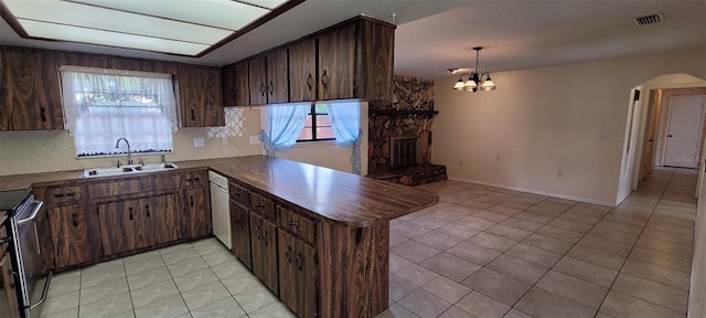 406WRIGHTST Wright St, Inverness, FL 34452 - kitchen with dark countertops, arched walkways, light tile patterned floors, and plenty of natural light