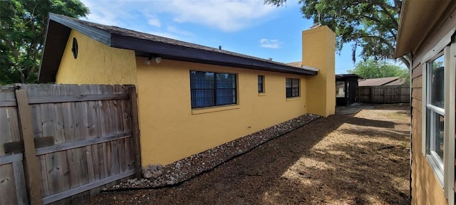 406WRIGHTST Wright St, Inverness, FL 34452 - view of home's exterior with stucco siding and a chimney