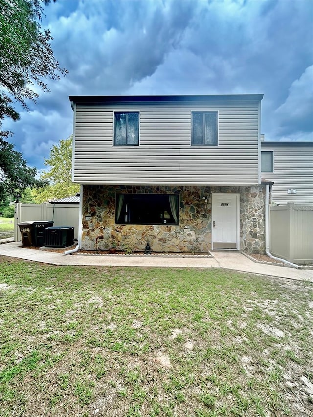 2214 NE 45th Ave Unit 3, Ocala, FL 34470 - back of house featuring stone siding