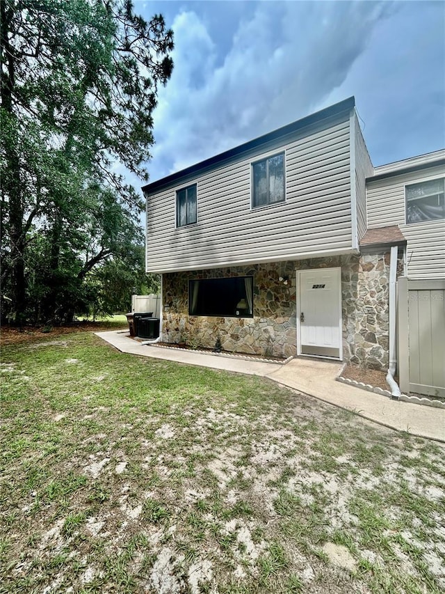 2214 NE 45th Ave Unit 3, Ocala, FL 34470 - back of property featuring stone siding