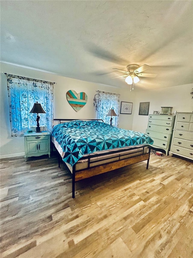 2214 NE 45th Ave Unit 3, Ocala, FL 34470 - bedroom featuring wood finished floors and a ceiling fan