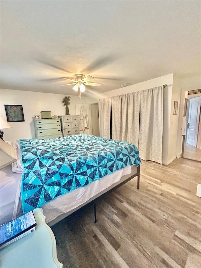 2214 NE 45th Ave Unit 3, Ocala, FL 34470 - bedroom with light wood-type flooring and ceiling fan