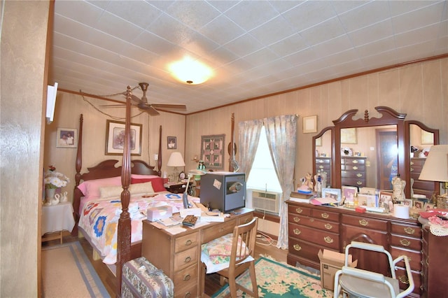 bedroom with ceiling fan, cooling unit, and crown molding