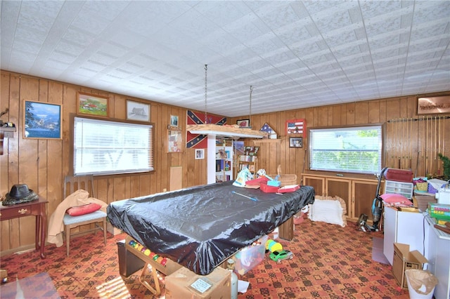 rec room with wooden walls and pool table