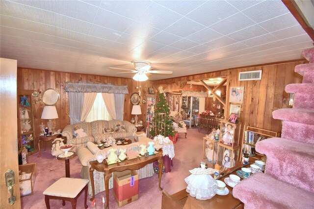 living room with carpet flooring and ceiling fan