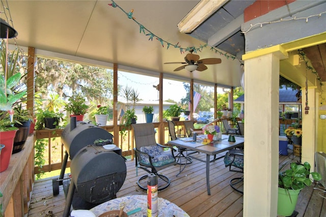 sunroom / solarium with ceiling fan and a wealth of natural light