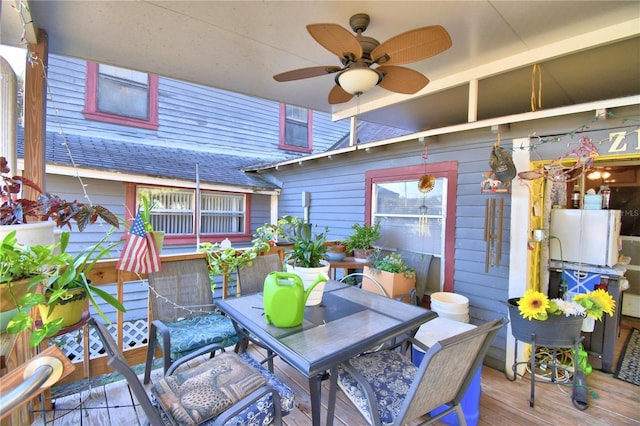 wooden terrace featuring ceiling fan