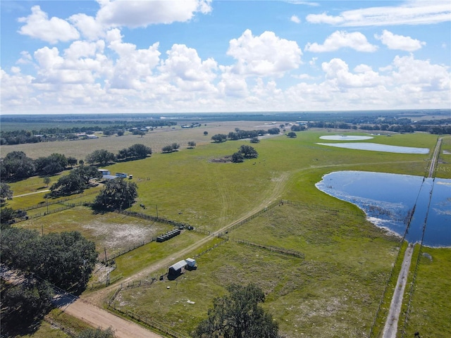 birds eye view of property featuring a rural view and a water view