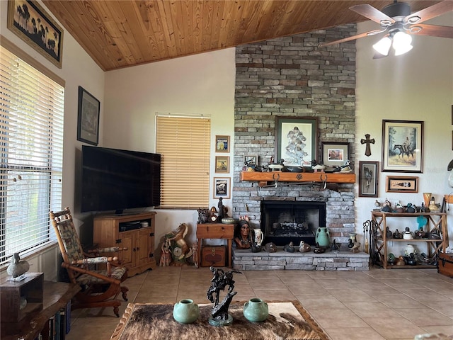 living room featuring a fireplace, light tile patterned floors, vaulted ceiling, ceiling fan, and wood ceiling