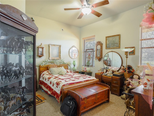 bedroom featuring ceiling fan and light colored carpet