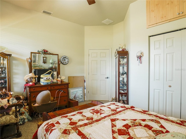 bedroom with carpet floors, ceiling fan, and a closet