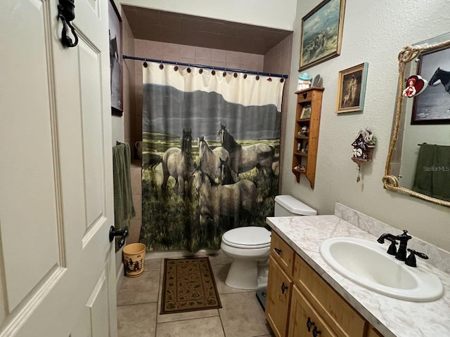 bathroom featuring vanity, toilet, walk in shower, and tile patterned flooring