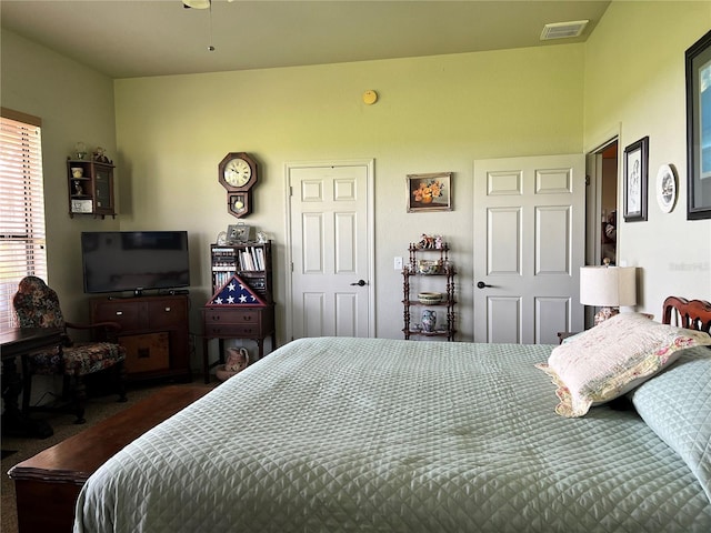 bedroom with dark carpet