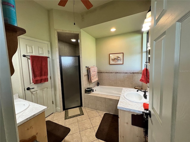 bathroom featuring tile patterned flooring, separate shower and tub, ceiling fan, and vanity