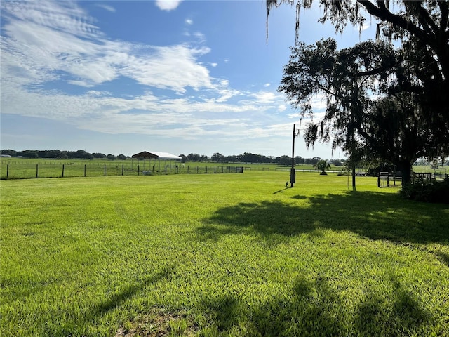 view of yard with a rural view