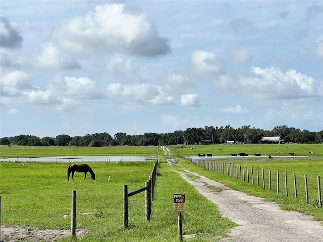 exterior space with a water view and a rural view