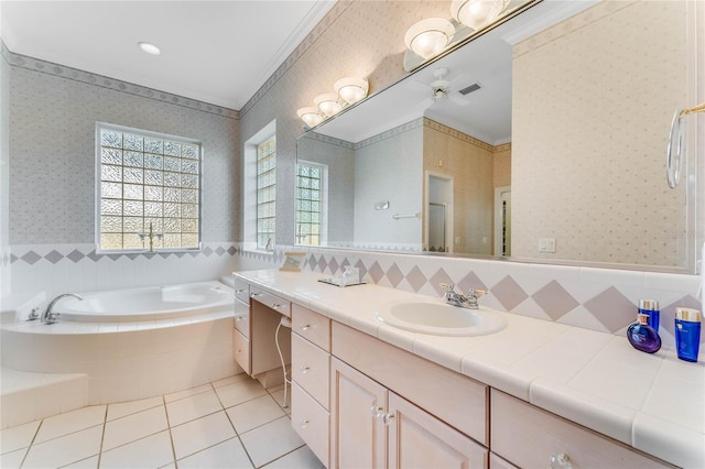 bathroom with vanity, tile patterned flooring, ornamental molding, and tiled bath