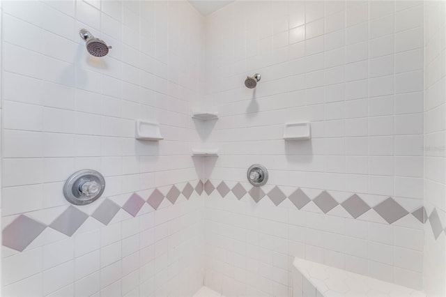 bathroom with tiled shower