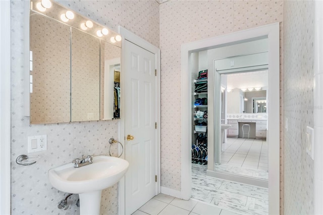 bathroom featuring tile patterned flooring and sink