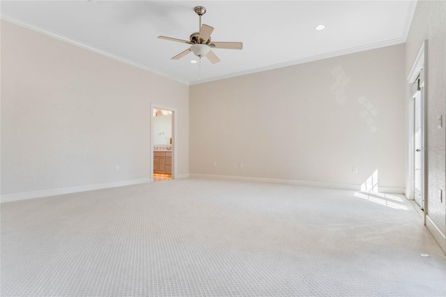 unfurnished room featuring crown molding, light colored carpet, and ceiling fan