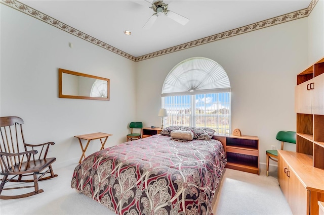 bedroom with light carpet and ceiling fan