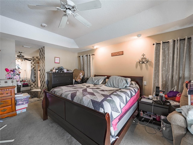 bedroom featuring ceiling fan and dark colored carpet