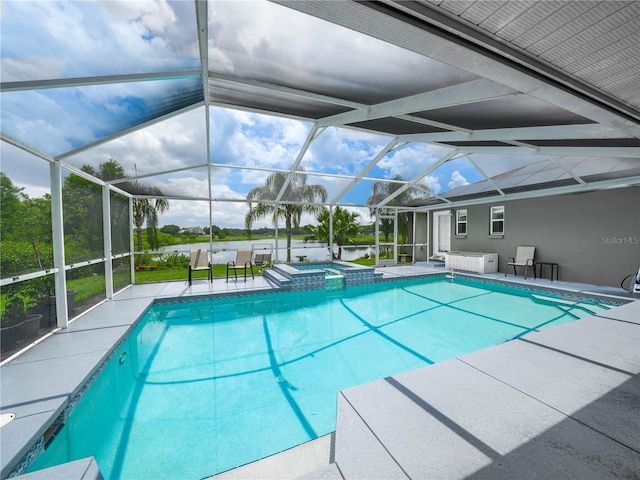 view of pool with a patio, an in ground hot tub, and a lanai