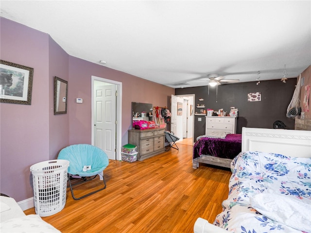bedroom featuring light hardwood / wood-style floors and ceiling fan