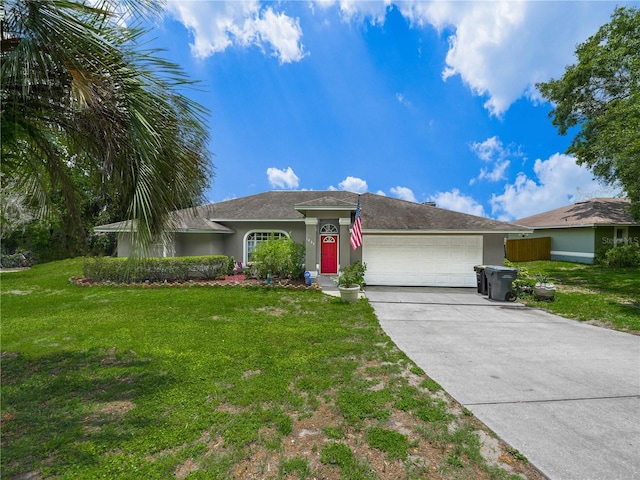 ranch-style home featuring a front lawn and a garage