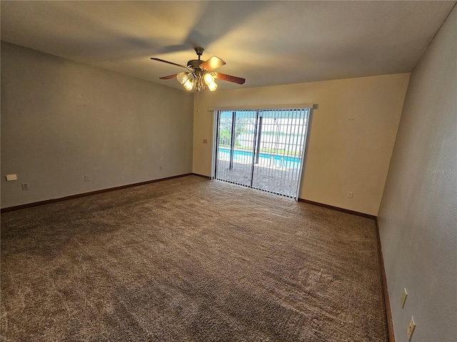 carpeted spare room featuring ceiling fan