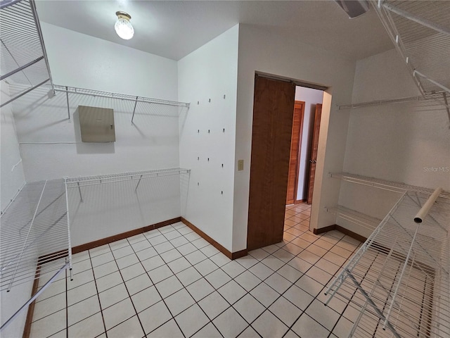 walk in closet featuring light tile patterned floors